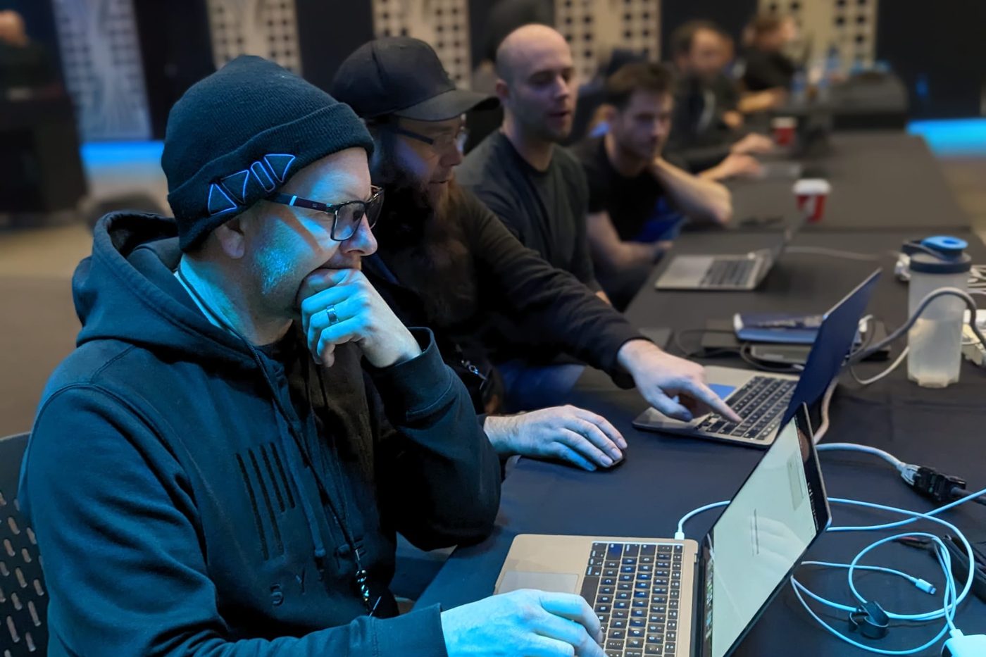 A PK engineer working at a laptop during a system session